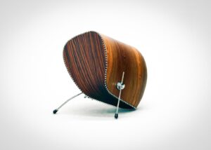 Antrea Tzourovits, Pins and needles 2026 90 x 50 x 70 cm, Bolivian rosewood, Indian rosewood, walnut wood, aluminium, stainless steel push pins, stainless steel bass drum feet, musical instrument binding purfling strips, varnish. | Photo: Courtesy of the artist and Bernier/Eliades Gallery